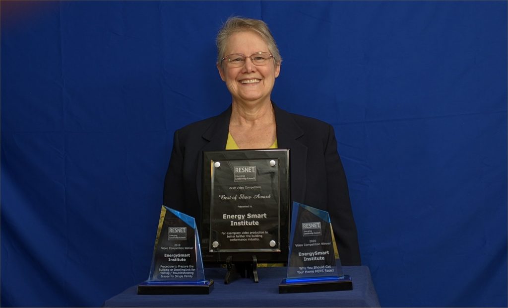 Sharla Riead holding RESNET video awards